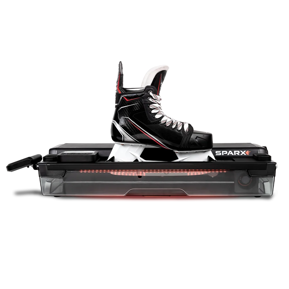 Ryan and Tyler's Sparx skate sharpening machine with a hockey skate mounted on it